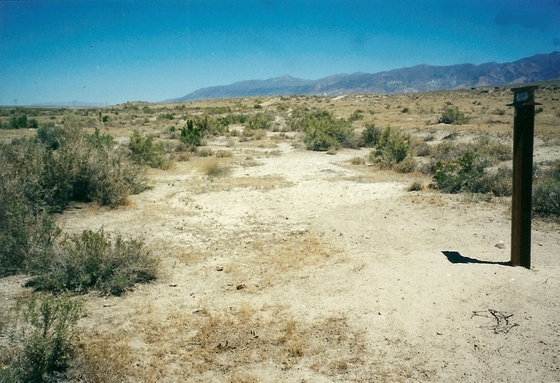 THE TRAIL HEADS SOUTH PAST MARKER C-69